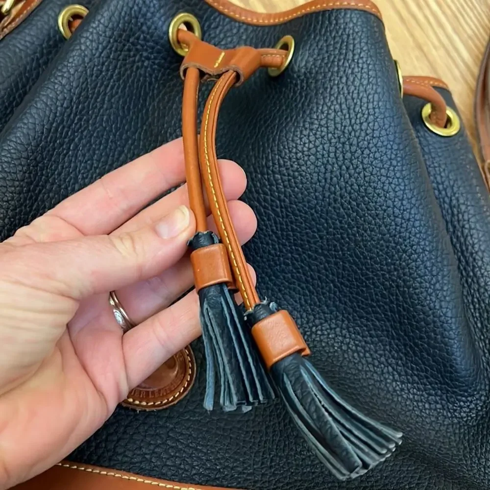 Dooney & Bourke tassel bucket bag blue pebbled leather tan accent gold hardware